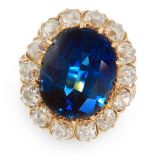 AN IMPORTANT SAPPHIRE AND DIAMOND DRESS RING in 18ct yellow gold, set with a cushion cut sapphire of
