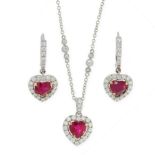 A RUBY AND DIAMOND PENDANT, CHAIN AND EARRINGS SUITE in 18ct white gold, each set with a heart