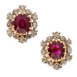 A PAIR OF UNHEATED RUBY AND DIAMOND STUD EARRINGS each set with a cushion cut ruby, both totalling