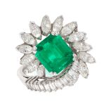 AN EMERALD AND DIAMOND DRESS RING, PIAGET in platinum, set with an emerald cut emerald of 1.64
