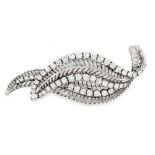 A VINTAGE DIAMOND BROOCH in platinum and 18ct white gold, designed as overlapping leaves, jewelled