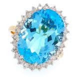 A BLUE TOPAZ AND DIAMOND CLUSTER RING in 18ct yellow gold, set with an oval cut topaz in a cluster