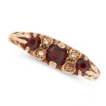 AN ANTIQUE GARNET AND WHITE GEMSTONE RING in yellow gold, set with three round cut garnets and
