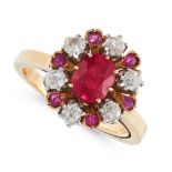 A RUBY AND DIAMOND DRESS RING, 1960s in 18ct yellow gold, set with an oval cut ruby in a border of