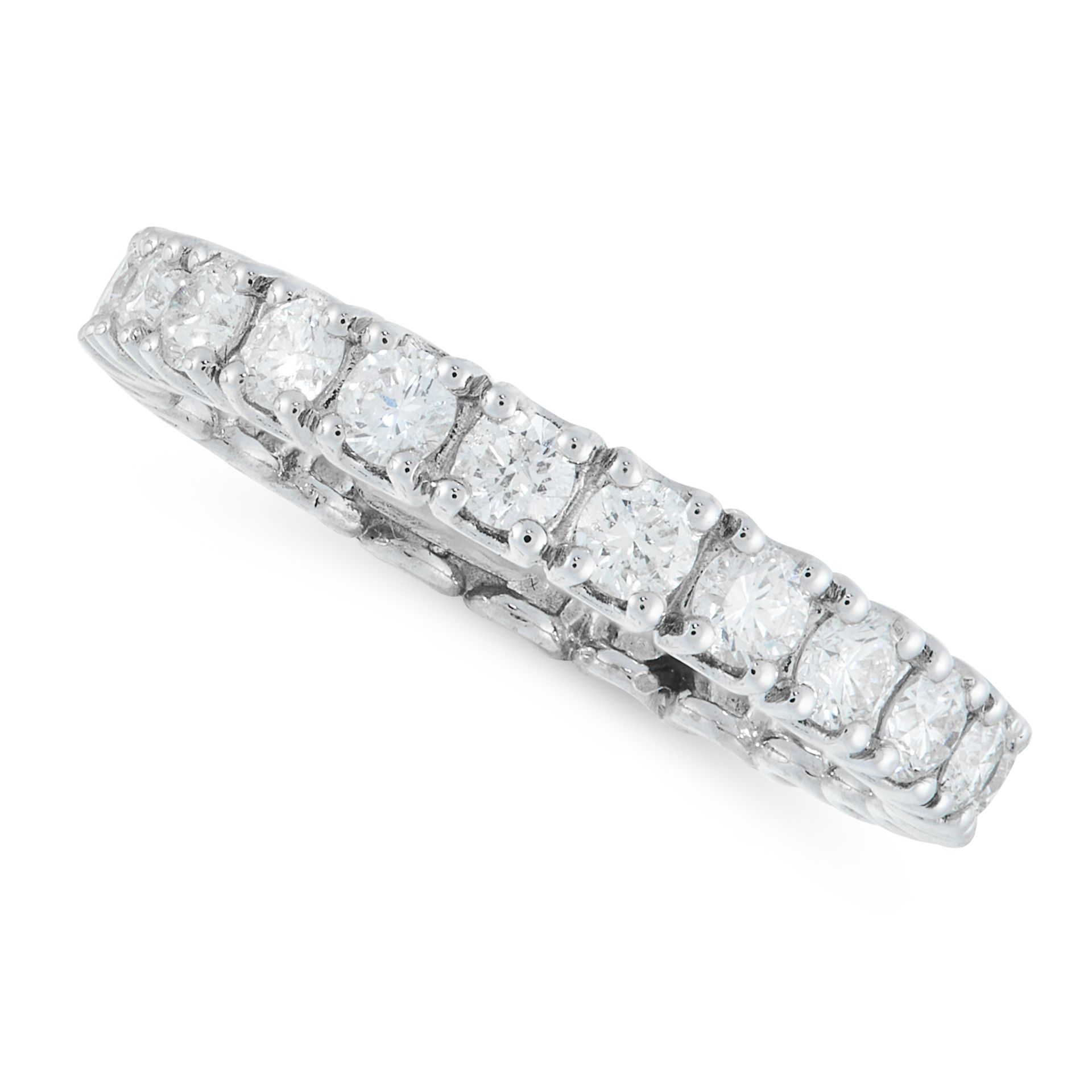 A DIAMOND ETERNITY BAND RING in white gold, designed as a full eternity, set with round cut diamonds
