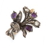 AN ANTIQUE AMETHYST AND DIAMOND RING, EARLY 19TH CENTURY in yellow gold and silver, in the form of a
