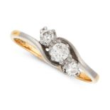 A DIAMOND THREE STONE RING in yellow gold, the twisted shank is set with a trio of old and round cut