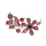 AN ANTIQUE GARNET BROOCH, 19TH CENTURY in silver, designed as a spray of foliage, set with flat