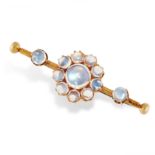 AN ANTIQUE MOONSTONE BAR BROOCH in yellow gold, set with a cluster of cabochon moonstone and two