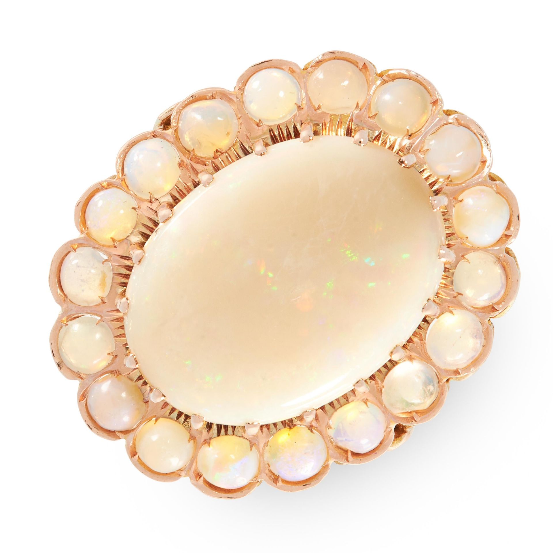 AN OPAL COCKTAIL RING in 18ct yellow gold, set with a central cabochon opal of 4.67 carats within