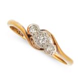 A DIAMOND THREE STONE RING in 18ct yellow gold, the twisted shank is set with a trio of old cut