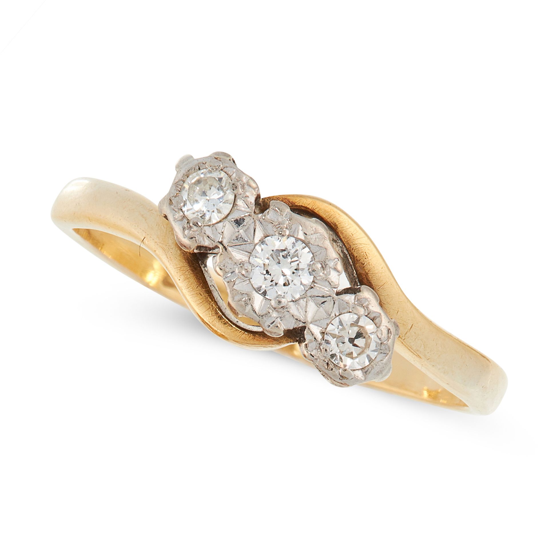 A DIAMOND THREE STONE RING in 18ct yellow gold, the twisted shank is set with a trio of round cut