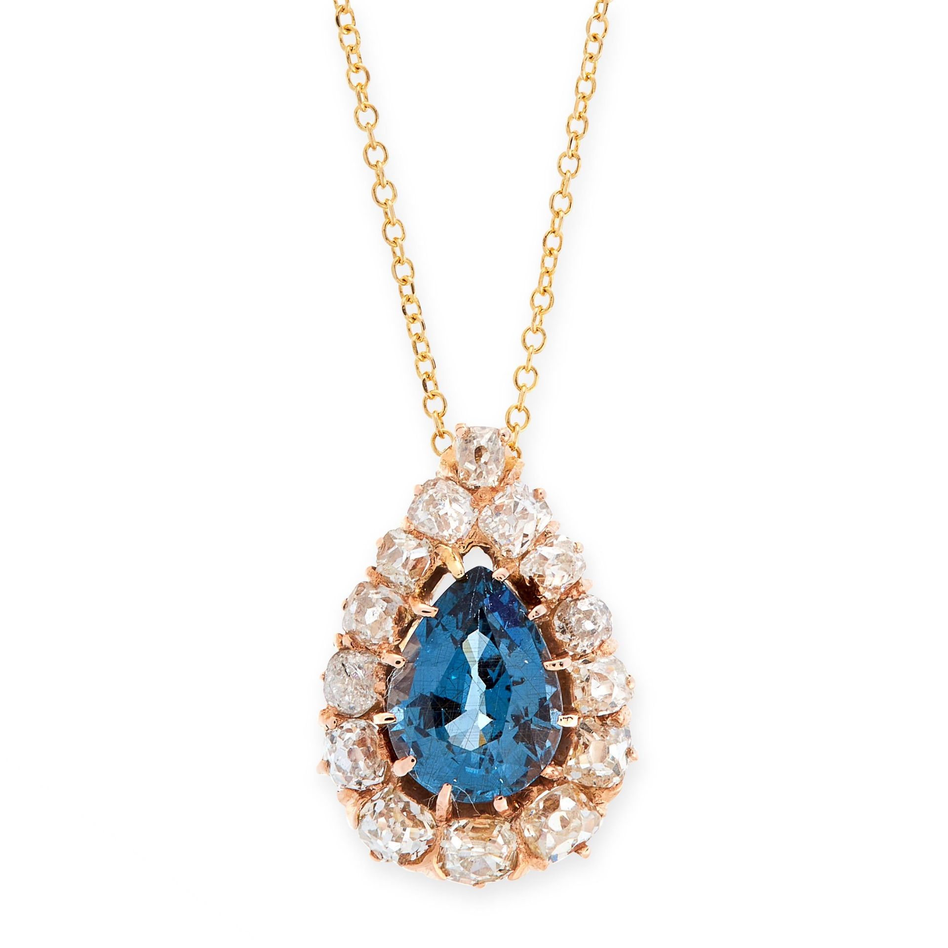 AN ANTIQUE SAPPHIRE AND DIAMOND PENDANT AND CHAIN in 18ct yellow gold, the pendant set with a pear