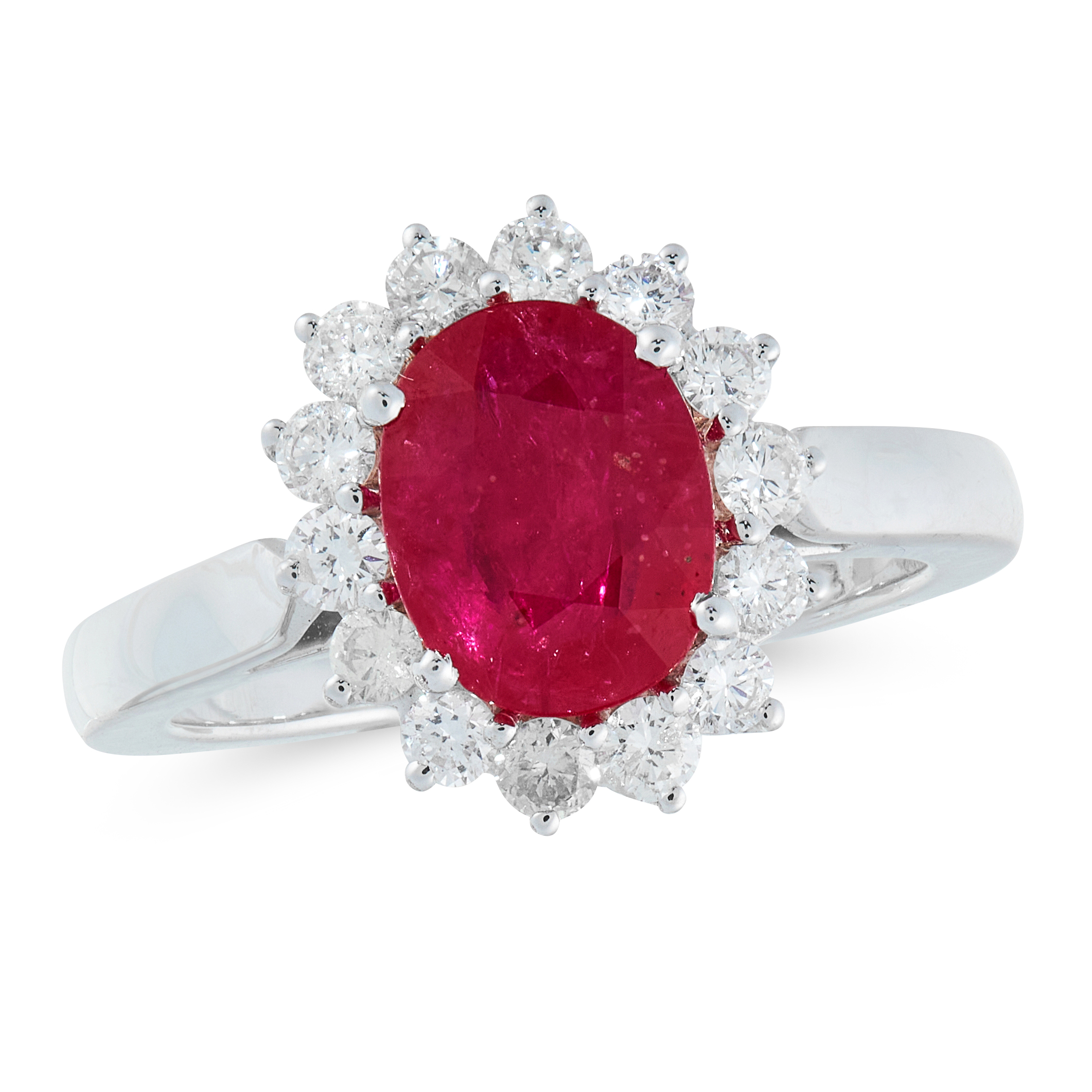 A RUBY AND DIAMOND CLUSTER RING in 18ct white gold, set with an oval cut ruby of 2.08 carats in a