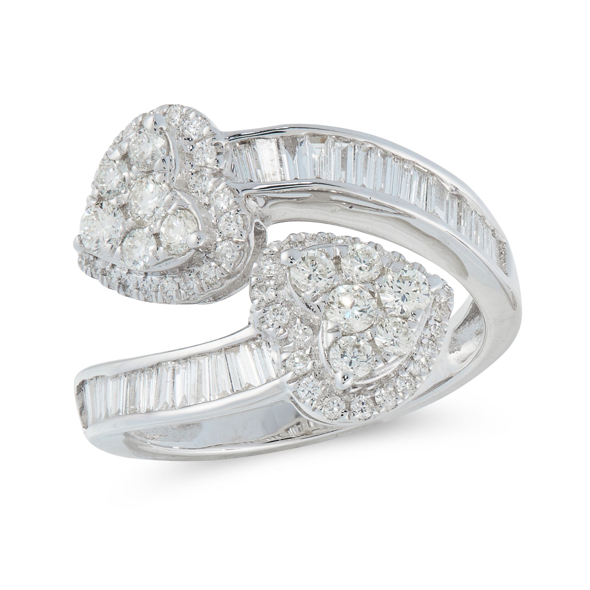 A DIAMOND CROSSOVER RING in 18ct white gold, in open band design, half set with baguette cut