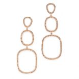 A PAIR OF DIAMOND DROP EARRINGS in the form of three graduated oval drops, set with round cut