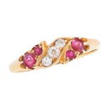 AN ANTIQUE RUBY AND DIAMOND DRESS RING, 1908 in 18ct yellow gold, the stylised scrolling band set