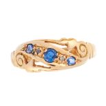 AN ANTIQUE SAPPHIRE AND DIAMOND DRESS RING, 1915 in 18ct yellow gold, the stylised scrolling band