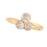 AN ANTIQUE DIAMOND DRESS RING, CIRCA 1900 in 18ct yellow gold, set with a trio of diamonds in a