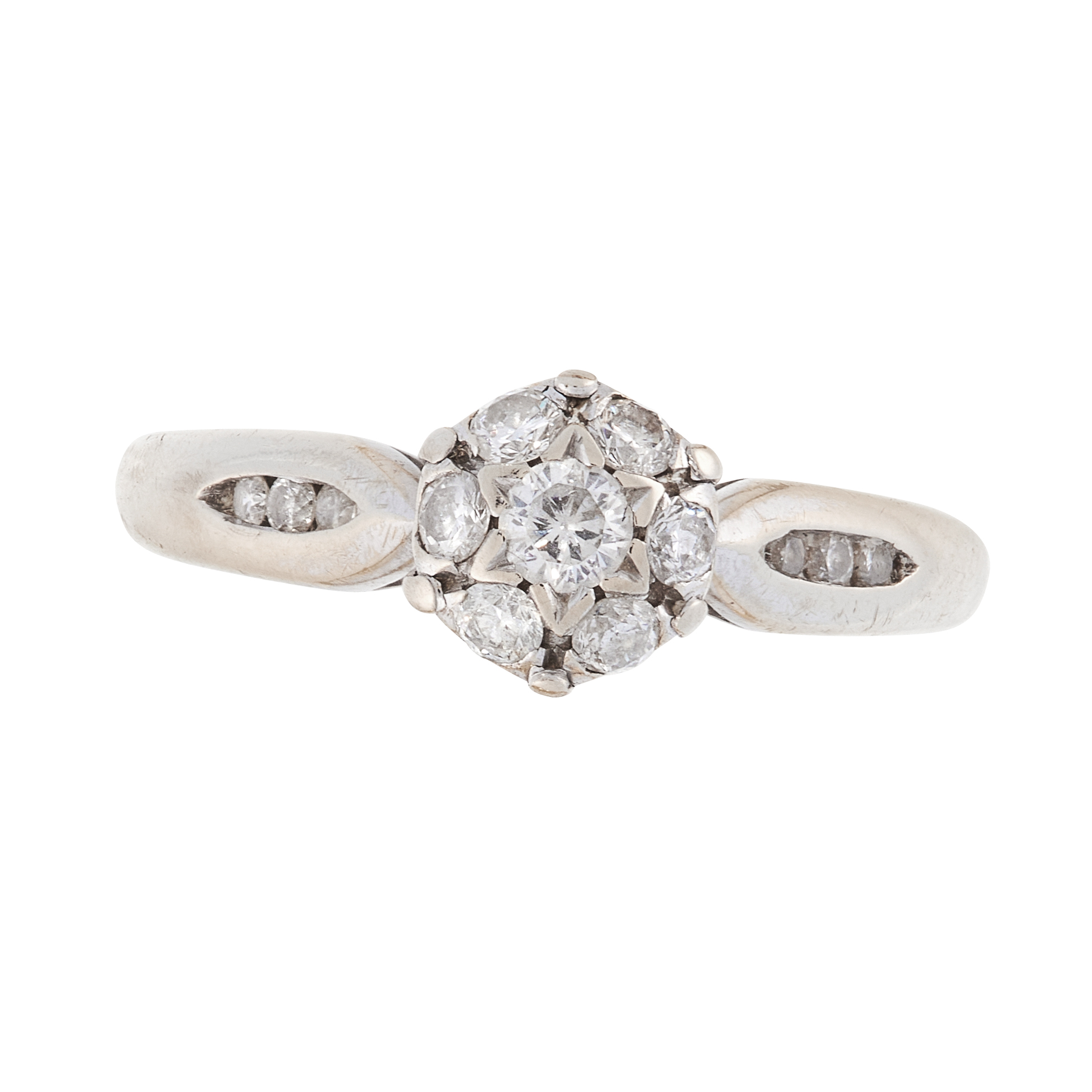 A DIAMOND CLUSTER DRESS RING in 18ct gold, set with a cluster of seven round cut diamonds, full