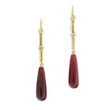 A PAIR OF GARNET AND DIAMOND DROP EARRINGS in high carat yellow gold, each set with a polished