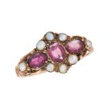 AN ANTIQUE GARNET AND PEARL DRESS RING in 12ct yellow gold, set with a trio of oval cut garnets