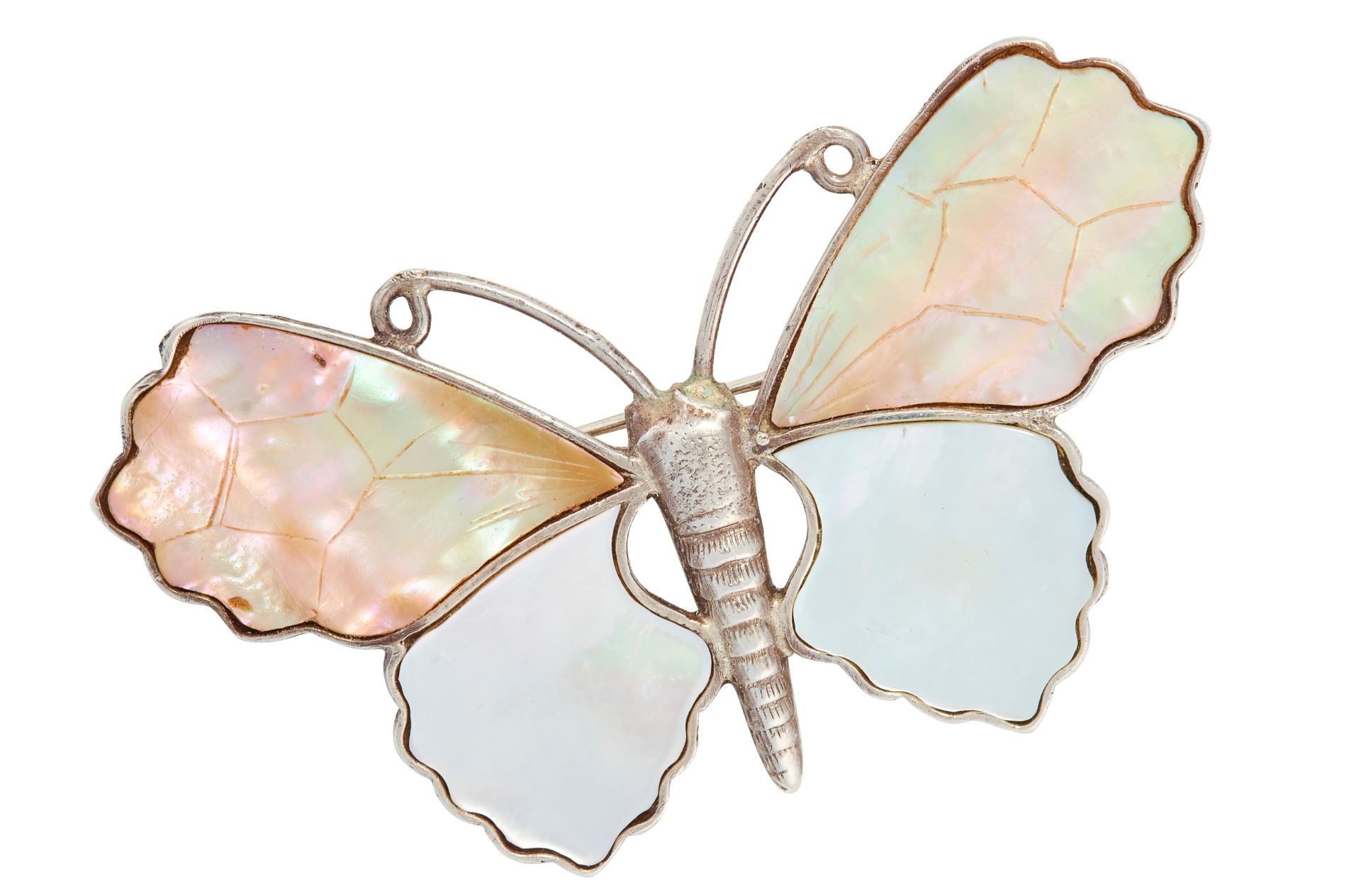 A MOTHER OF PEARL BUTTERFLY BROOCH in silver, designed as a butterfly, the wings set with polished