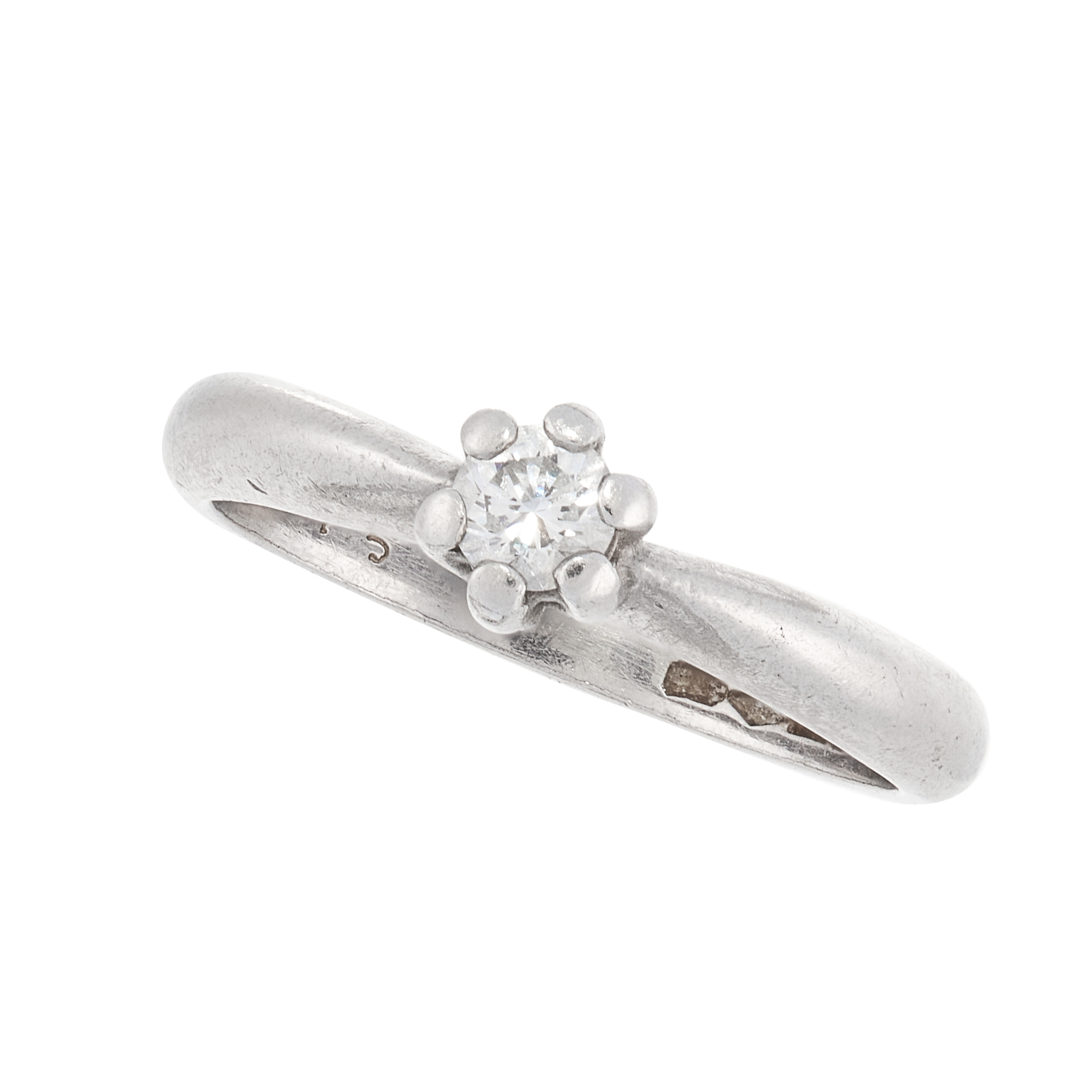 A SOLITAIRE DIAMOND DRESS RING in platinum, set with a round cut diamond within a tapering band,
