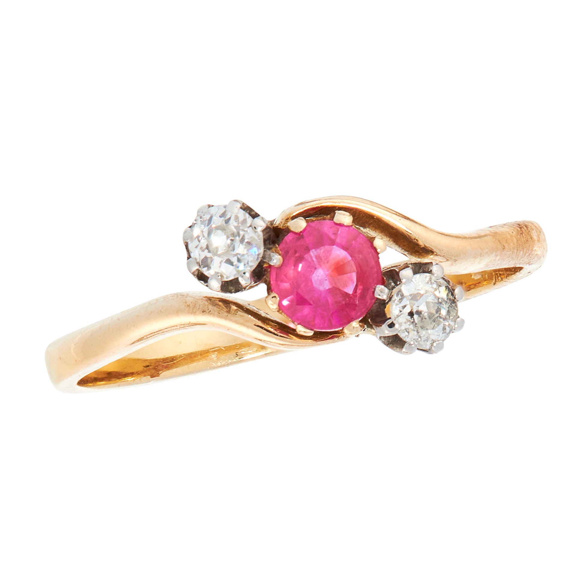 A RUBY AND DIAMOND DRESS RING, EARLY 20TH CENTURY in 18ct yellow gold, set with a round cut ruby