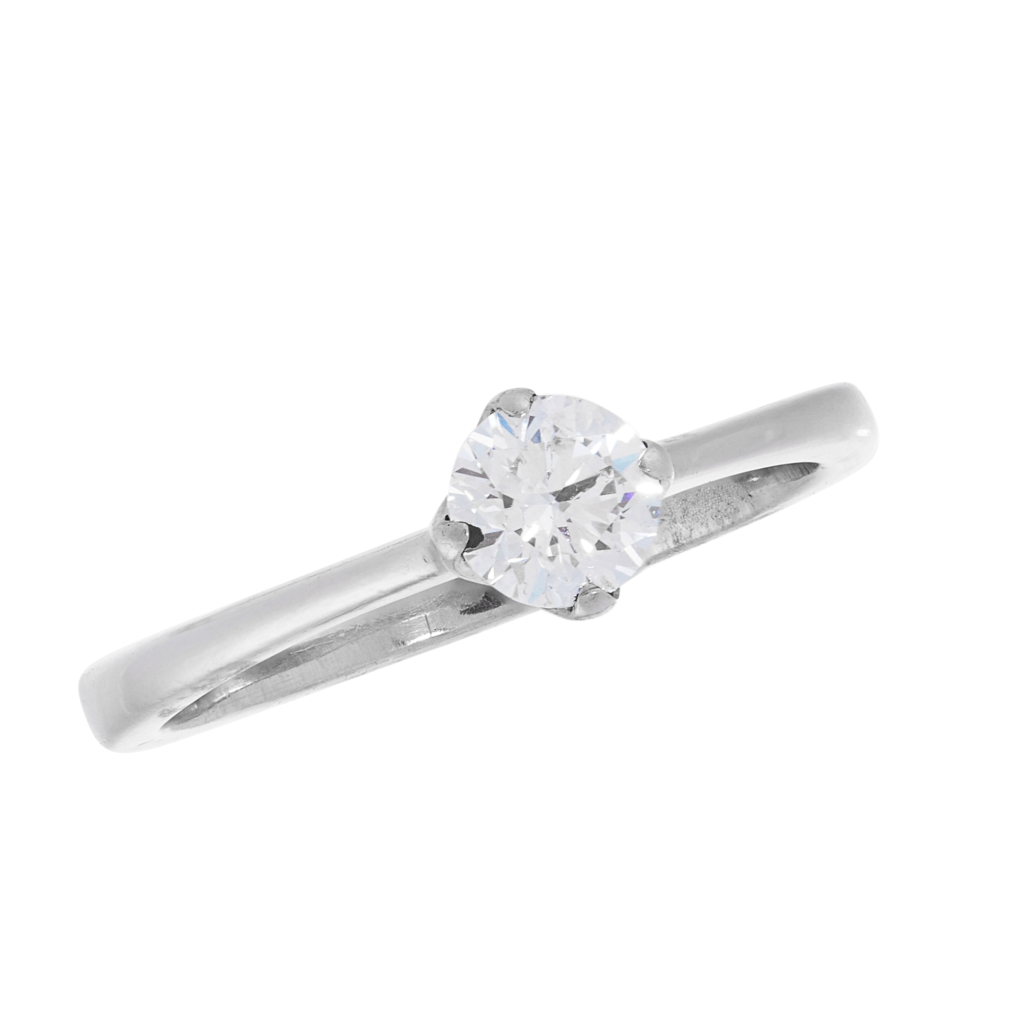 A SOLITAIRE DIAMOND DRESS RING in platinum, set with a round cut diamond of 0.50 carats within a