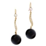 A PAIR OF PEARL, DIAMOND AND ONYX DROP EARRINGS comprising of a pearl above a swirl motif set with