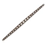 AN ANTIQUE DIAMOND BAR BROOCH in yellow gold and silver, the tapering bar set with twenty three rose