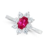 A RUBY AND DIAMOND CLUSTER RING in 18ct white gold, set with an oval cut ruby of 0.60 carats