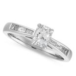 A DIAMOND DRESS RING in platinum, set with a central radiant cut diamond of 0.52 carats, between