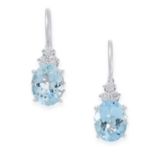 A PAIR OF AQUAMARINE AND DIAMOND EARRINGS in 18ct white gold, each set with an oval cut aquamarine
