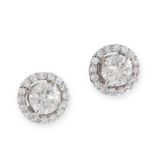 A PAIR OF DIAMOND HALO STUD EARRINGS in 18ct white gold, each set with a round cut diamonds in a