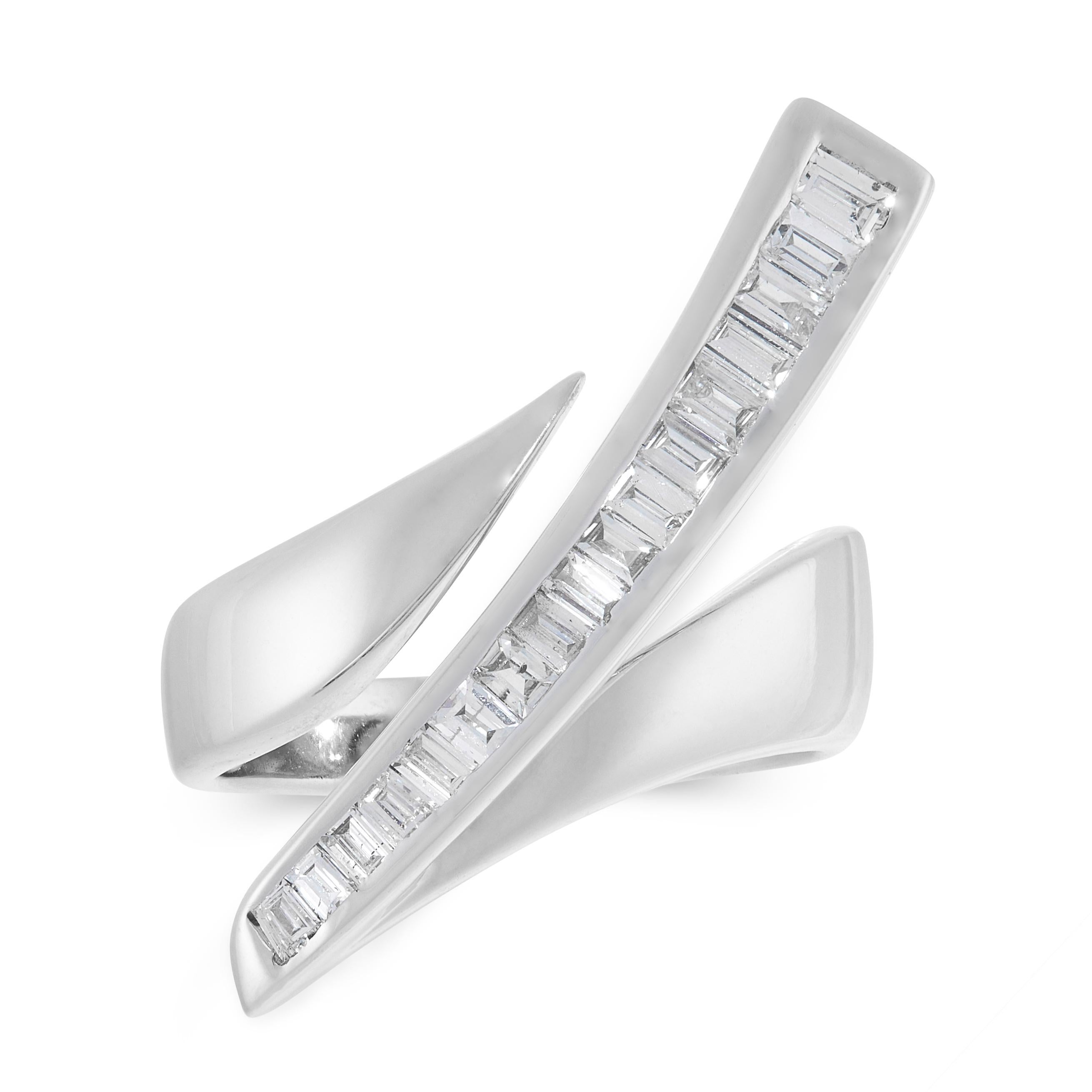 A DIAMOND DRESS RING in 18ct white gold, in abstract design, set with a tapering bar set with