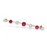 AN ANTIQUE RUBY AND DIAMOND BAR BROOCH in high carat yellow gold, set with a trio of graduated