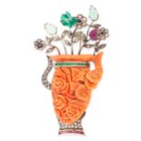 A CORAL, EMERALD, RUBY, DIAMOND AND SAPPHIRE VASE BROOCH comprising of a carved coral vase, jewelled