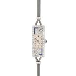 AN ANTIQUE ART DECO DIAMOND AND SAPPHIRE COCKTAIL WATCH in Art Deco geometric design, the