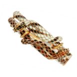 A RUBY, DIAMOND AND ENAMEL SNAKE BANGLE in high carat yellow gold, designed as two snaked coiled