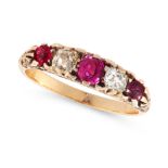 AN ANTIQUE RUBY AND DIAMOND DRESS RING in 18ct yellow gold, set with a trio of graduated cushion cut