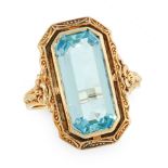 A VINTAGE AQUAMARINE DRESS RING, CIRCA 1940 in 14ct yellow gold, set with an emerald cut