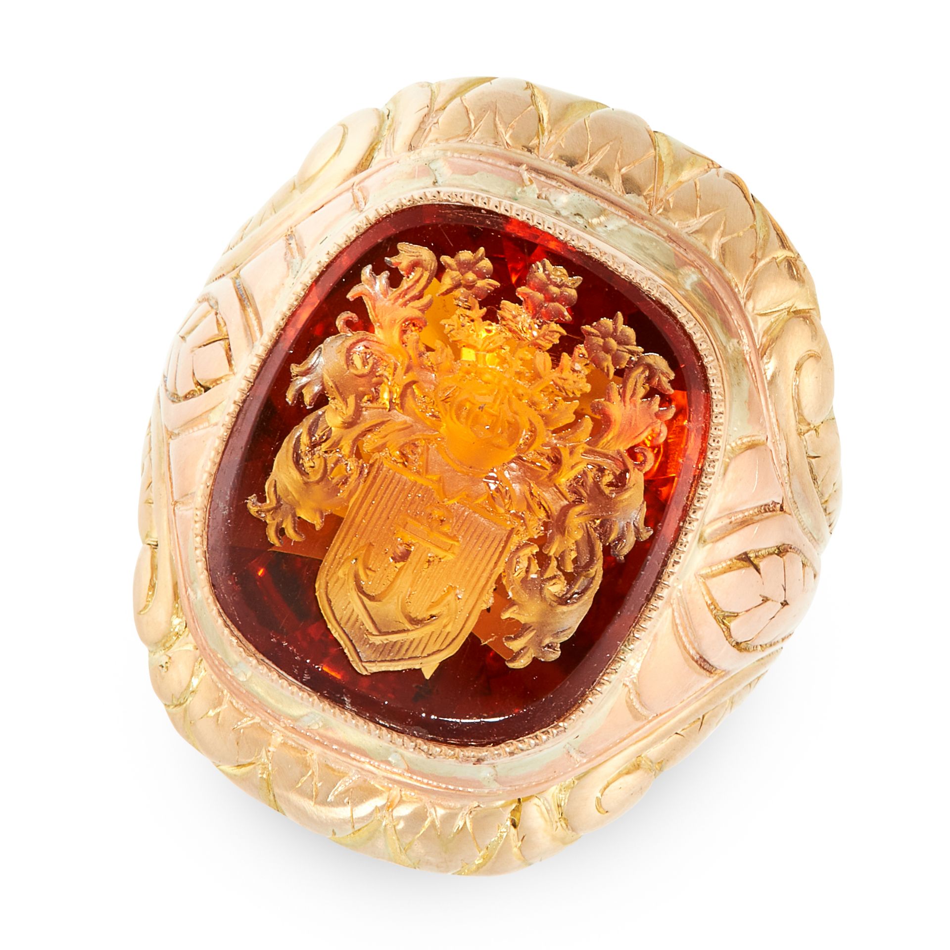 AN ANTIQUE CITRINE INTAGLIO SEAL RING in yellow gold, set with a cushion shaped faceted citrine, the