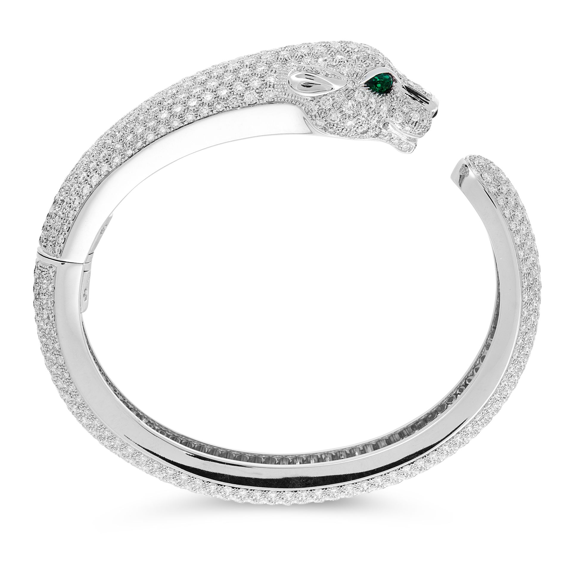 A DIAMOND AND EMERALD PANTHER BANGLE in 18ct white gold, designed as a coiling panther, set all over - Image 2 of 3