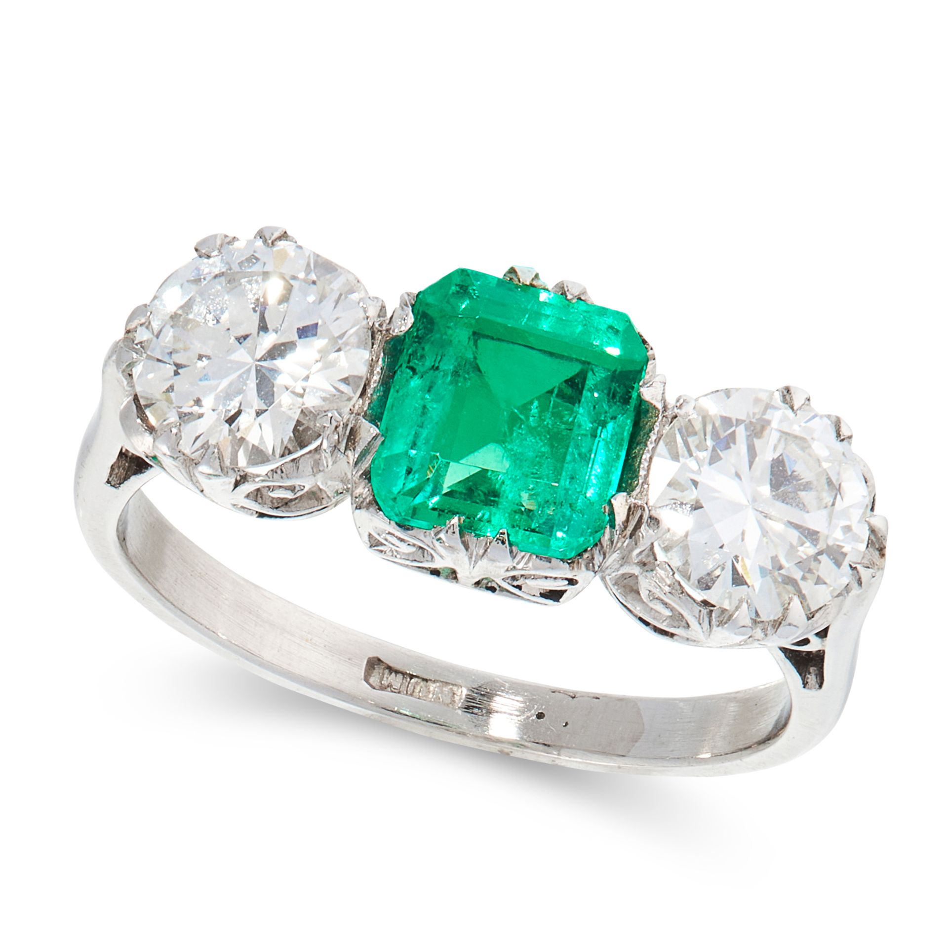 A COLOMBIAN EMERALD AND DIAMOND DRESS RING in platinum, set with an emerald cut emerald of 0.91