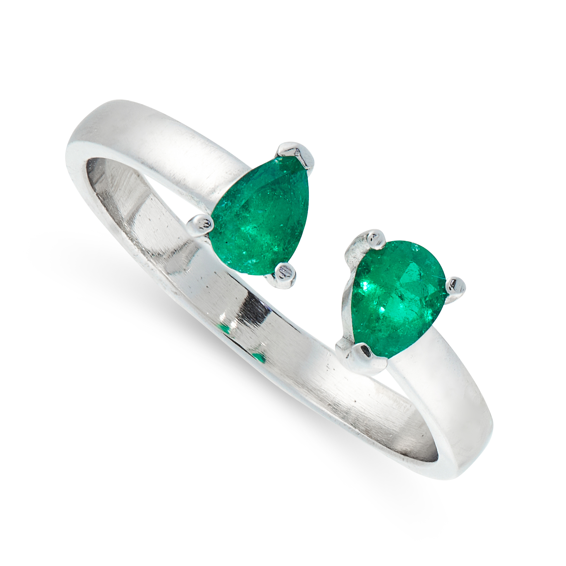 AN EMERALD RING in 18ct white gold, the open band is set with two pear cut emeralds, stamped 18K,