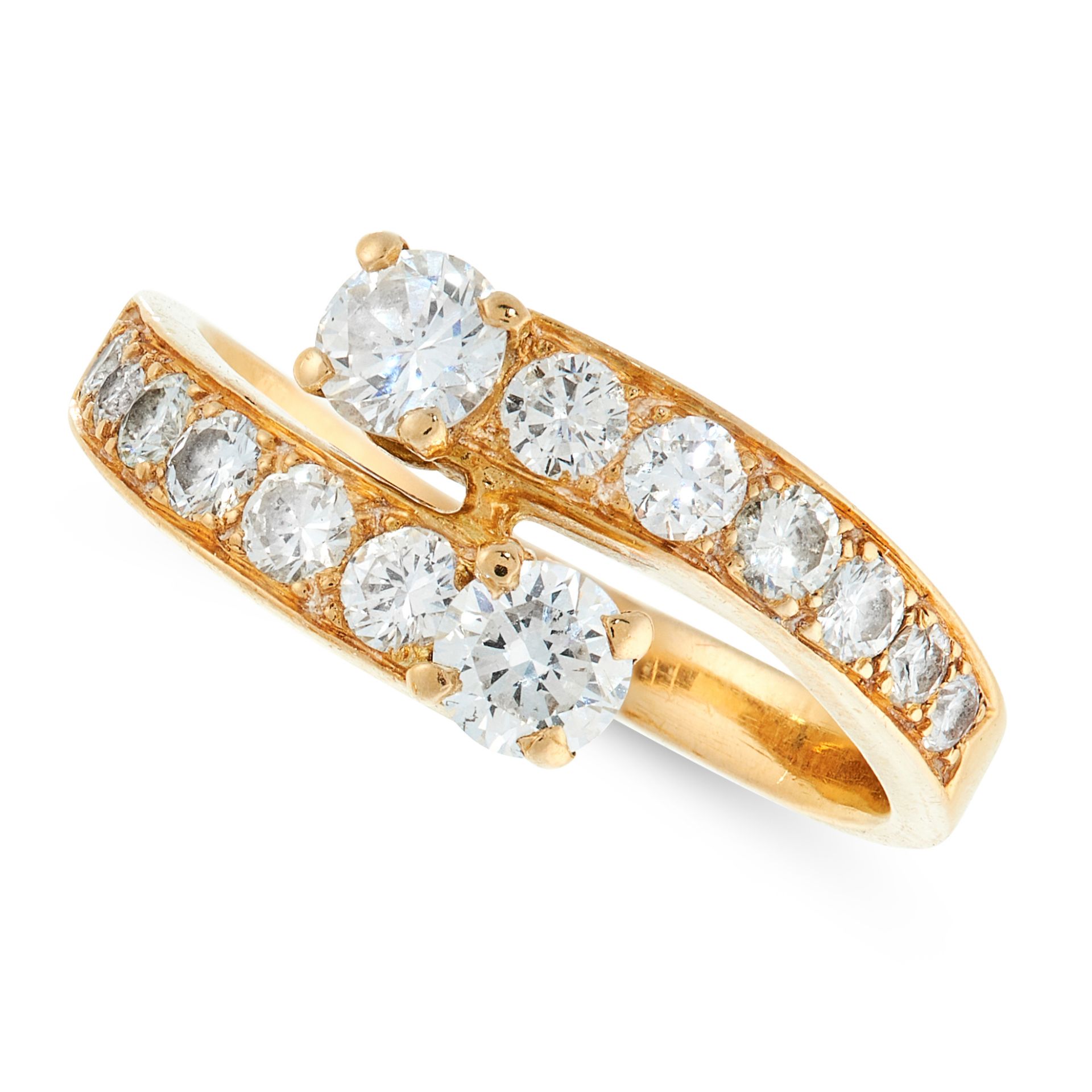 A VINTAGE DIAMOND DRESS RING in 18ct yellow gold, the twisted band half set with round cut diamonds,