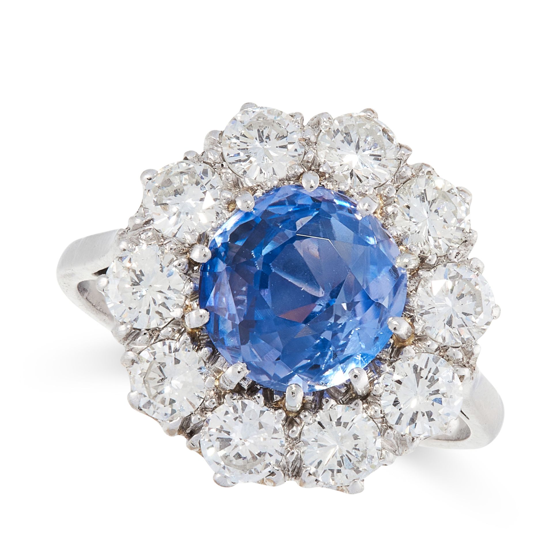 A CEYLON NO HEAT SAPPHIRE AND DIAMOND RING in platinum and 18ct white gold, set with a cushion cut