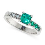 AN EMERALD AND DIAMOND RING comprising of a central emerald cut emerald of 0.7 carats between a